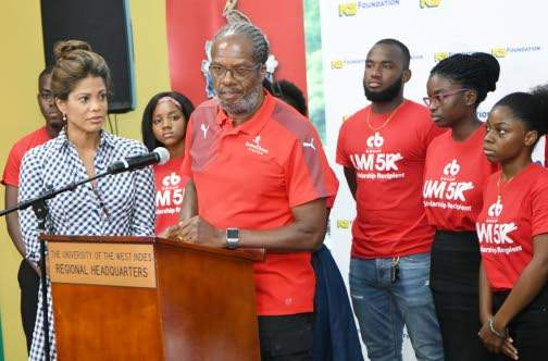 Alfred “Frano” Francis, race director, CB Group/UWI 5K, addresses the launch of the event last Wednesday at The UWI Regional Office. Scholarships were also distributed to students for the 2019-2020 school year. Looking on is Elizabeth Buchanan-Hind (left), chair of the fund-raising event to raise funds for students wishing to pursue tertiary education, but in need of financial assistance. Alfred “Frano” Francis, race director, CB Group/UWI 5K, addresses the launch of the event last Wednesday at The UWI Regional Office. Scholarships were also distributed to students for the 2019-2020 school year. Looking on is Elizabeth Buchanan-Hind (left), chair of the fund-raising event to raise funds for students wishing to pursue tertiary education, but in need of financial assistance.